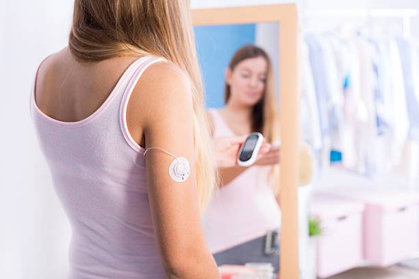 istock Diabetic girl with glucose meter 511532366