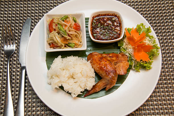 istock Green papaya salad, grilled chicken and sticky rice 511532956