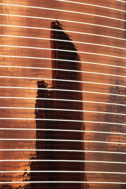 Office Building Window Glass Facade Reflection Office building reflection in the copper colored glass window facade of another. wynn las vegas stock pictures, royalty-free photos & images
