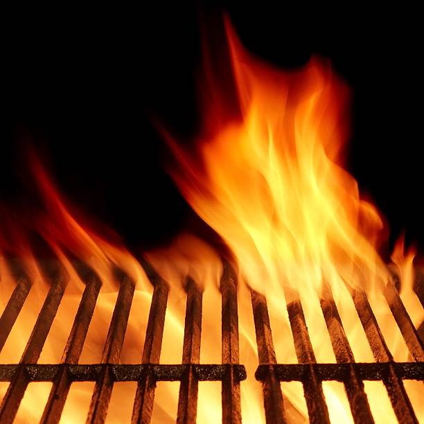 istock Empty Flaming Barbecue Grill Isolated On Black Background. Top V 511533646