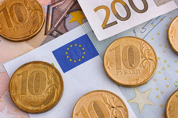 istock Ruble coins on euro banknotes 511535142