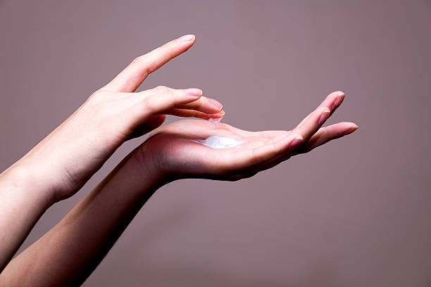 istock beautiful woman hands with cream 511536806