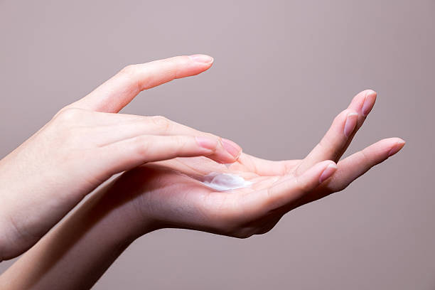 istock beautiful woman hands with cream 511536928