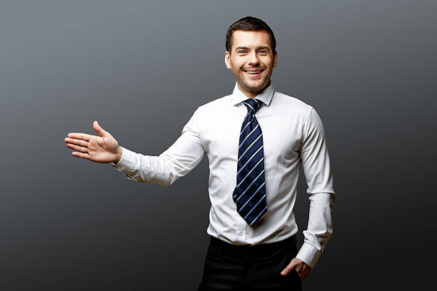 istock Handsome stylish businessman on grey background 511537248
