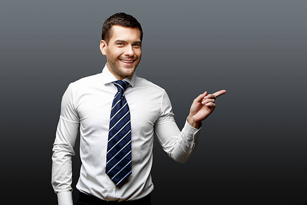 istock Handsome stylish businessman on grey background 511537424