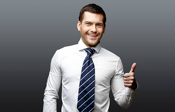 istock Handsome stylish businessman on grey background 511537480