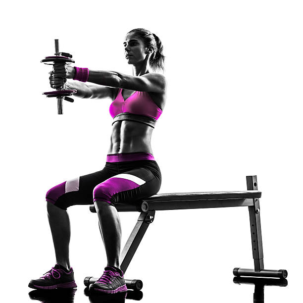 silhouette di donna fitness esercizi con pesi - women weight bench exercising weightlifting foto e immagini stock