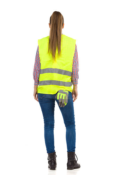 Woman In Lime Green Reflective Vest. Rear View.