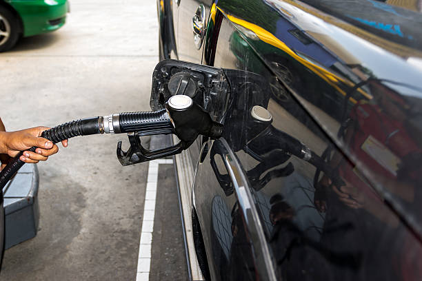 istock Fuel nozzle pay for fuel and benzyl. 511539612