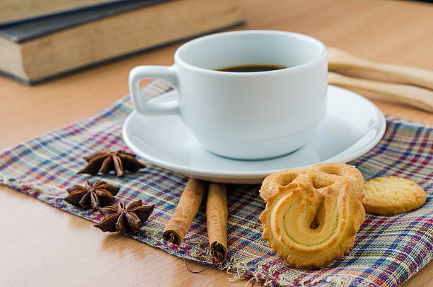 istock Coffee cookies on a wooden table for breakfast before work 511540326