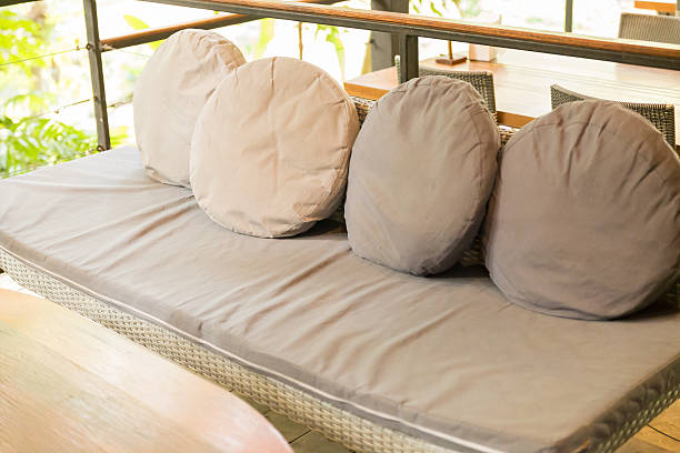 istock wicker sofa with  brown cushion and pillow 511540736
