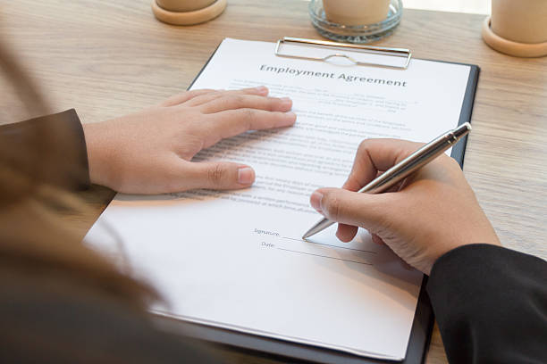istock Business woman signing contract document form 511540932