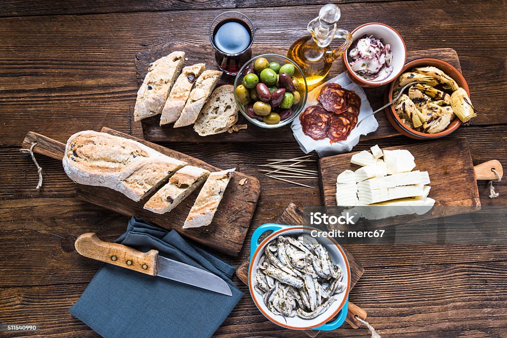 Spanish tapas, bar or street food Spanish tapas, bar or street food. On wooden table in restaurant Antipasto Stock Photo