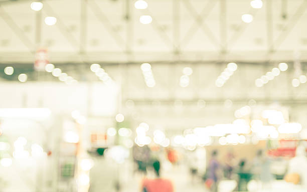 istock Blurred background : crowd of people in expo fair 511542622
