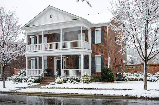 istock Traditional Brick Home During a Winter Snow Storm 511543058