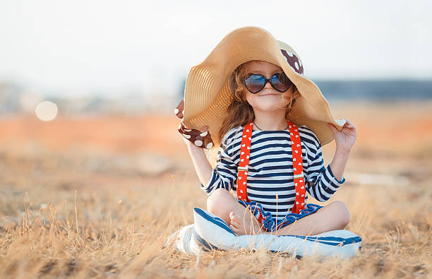 istock The happy little girl in a big hat 511543792