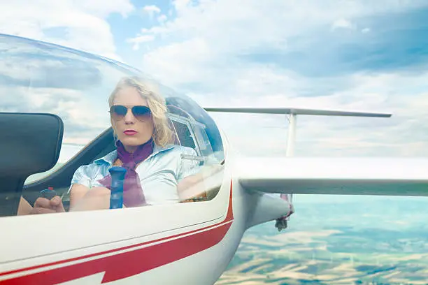 Photo of Woman piloting a glider.