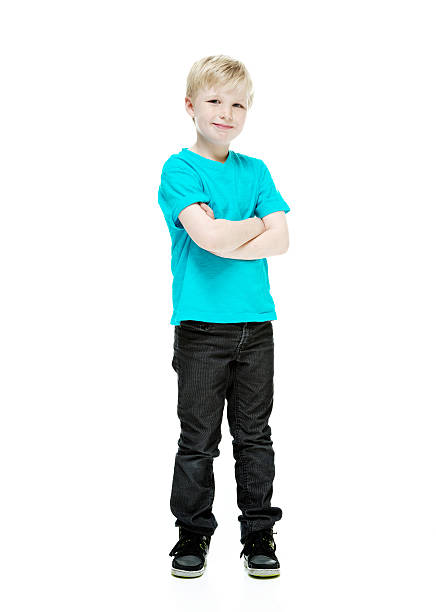 istock Little boy standing with arms crossed 511551437
