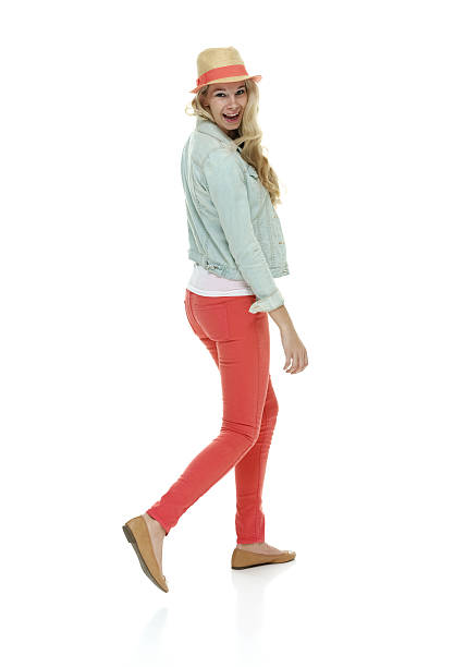 istock Cheerful woman walking & looking at camera 511554635