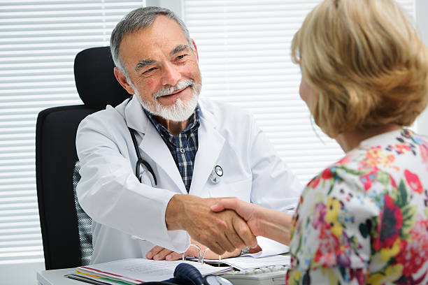 istock Doctor shaking hands to patient 511555353