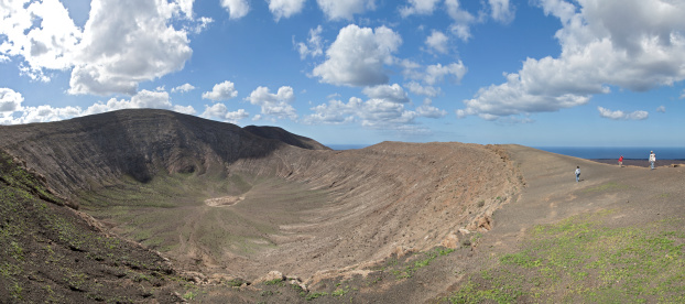 View into the crater of Caldera Blanca, one of the largest volcanic crater in Lanzarote, Canary Islands, Spain. You can completely hike around on the crater rim.