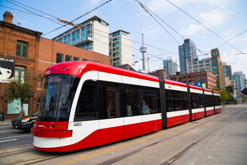 Toronto, Canada - September 9, 2014: A view of the new Toronto Street Cars during the day. Passengers can be seen on the vehicle