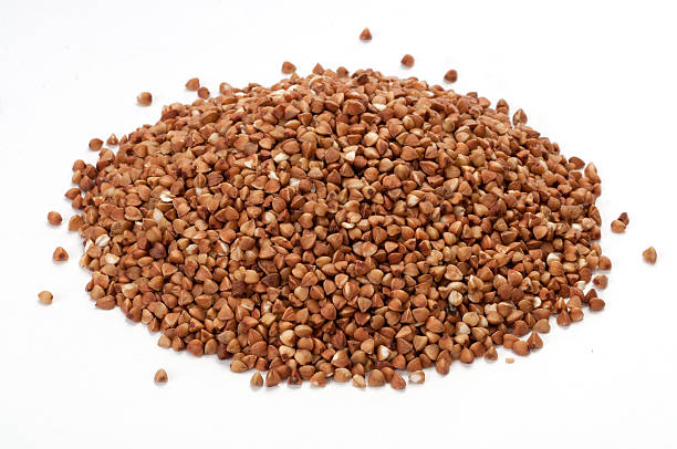 istock Pile of buckwheat on white background 511575341