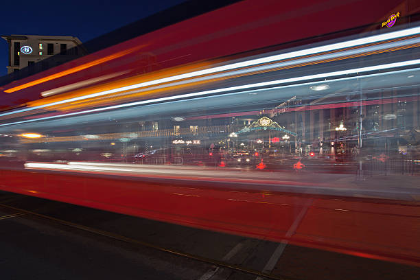 San Diego's public transportation and local landmark Red Trolley at Gaslamp District. Motion blur with Gaslamp sign in the background