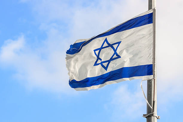 istock Flag of Israel over the sky 511577409