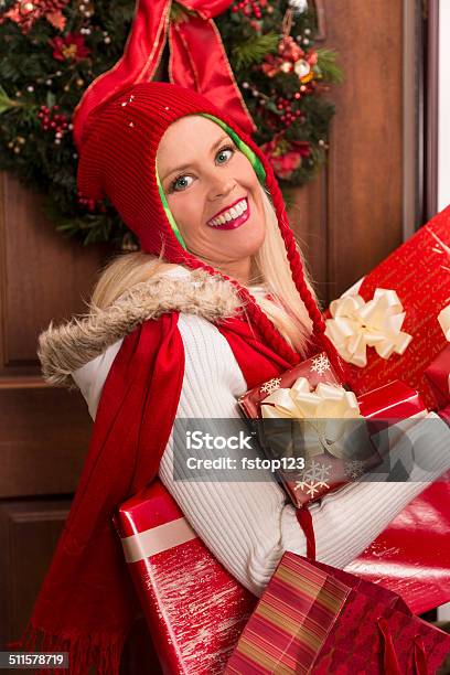 Christmas Woman Delivers Holiday Gifts Or Home From Shopping Day Stock Photo - Download Image Now