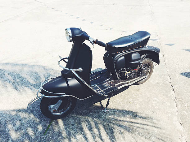 istock vintage black motorbike on light grey background 511579674