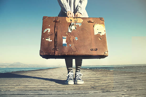 istock young woman ready to travel with her suitcase 511580382