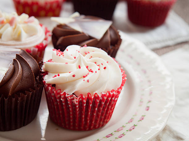 istock White and dark  chocolate cupcakes on natural rustic vintage table 511580548