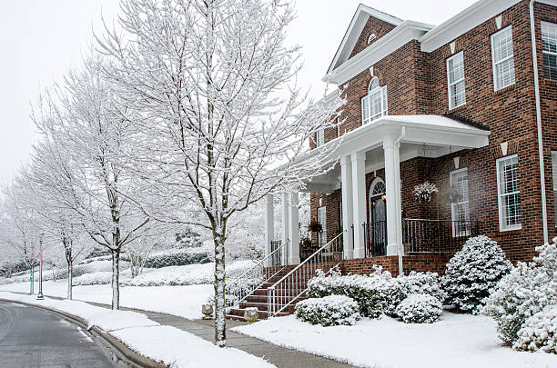 istock Traditional Brick Home During a Winter Snow Storm 511580864