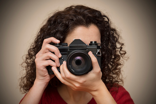 Woman Using SLR Camera
