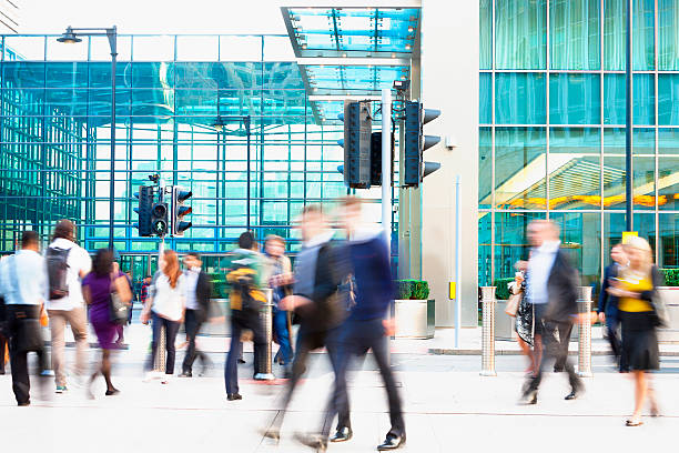 istock Blurred People Walking in Front of Modern Office Building, London 511582594