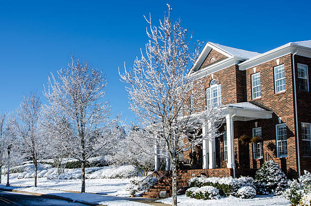 istock Traditional Brick Home During a Winter Snow Storm 511583710