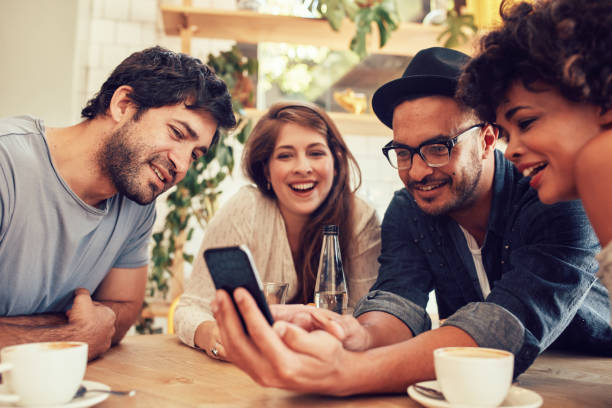istock Friends sharing some photos on mobile phone 511584700