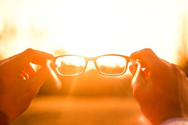 Glasses Sunset Glasses Sunset looking through an object stock pictures, royalty-free photos & images