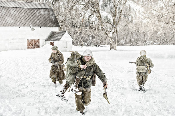 istock Soldiers in WWII Evacuating A Wounded Team Member 511585348