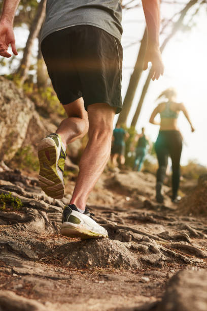istock Male runner on rough terrain outdoors 511586024
