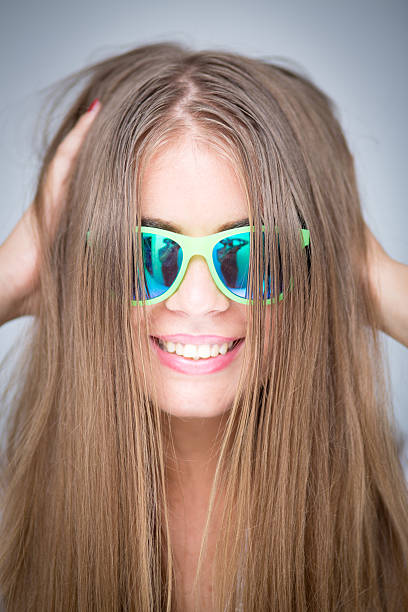Beautiful young woman with sunglasses stock photo