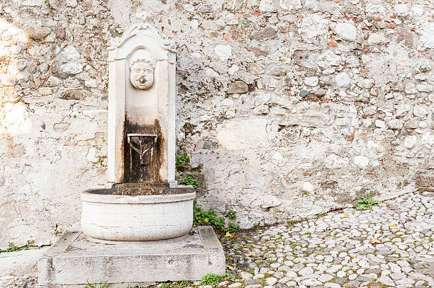 istock Small ancient fountain, of stone. 511589260