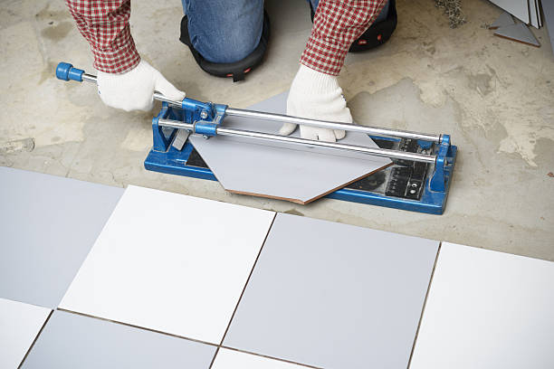 Cutting ceramic tiles stock photo