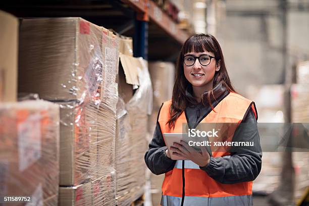 Portrait Of Worker Checking Box In Warehouse Stock Photo - Download Image Now - Women, Warehouse, Box - Container