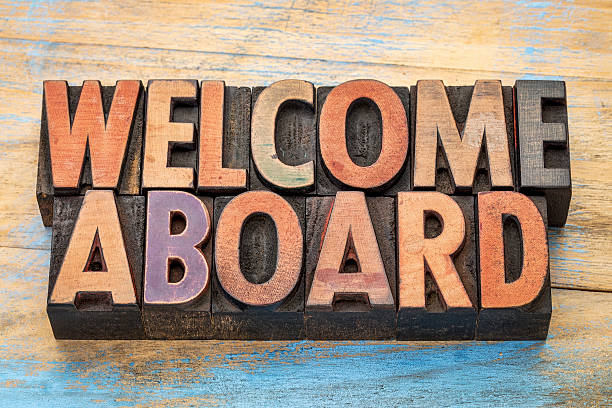 welcome aboard in wood type welcome aboard sign in vintage letterpress wood type blocks stained by color inks printing block photos stock pictures, royalty-free photos & images