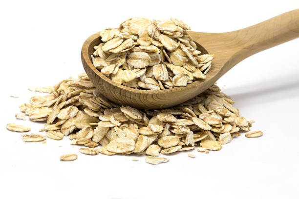 istock Rolled oats in wooden spoon 511590718