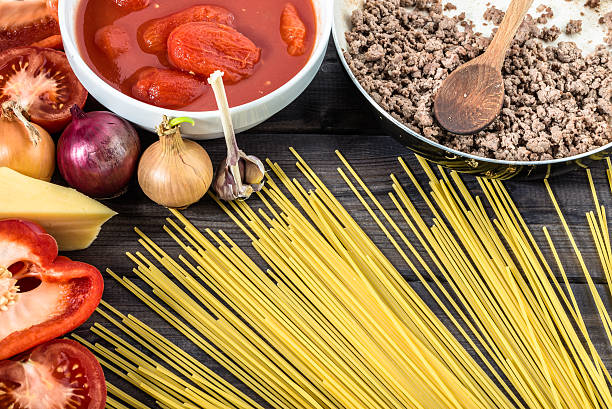 istock Ingredients of spaghetti bolognese arranged on wooden table. 511591114