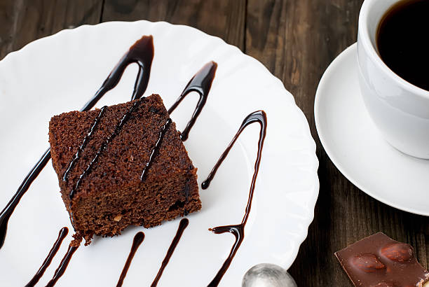 istock homemade cake brownie with cup of coffee 511591616