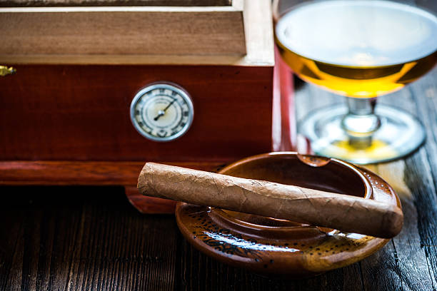 istock Cigar with glass of cognac and humidor 511593294